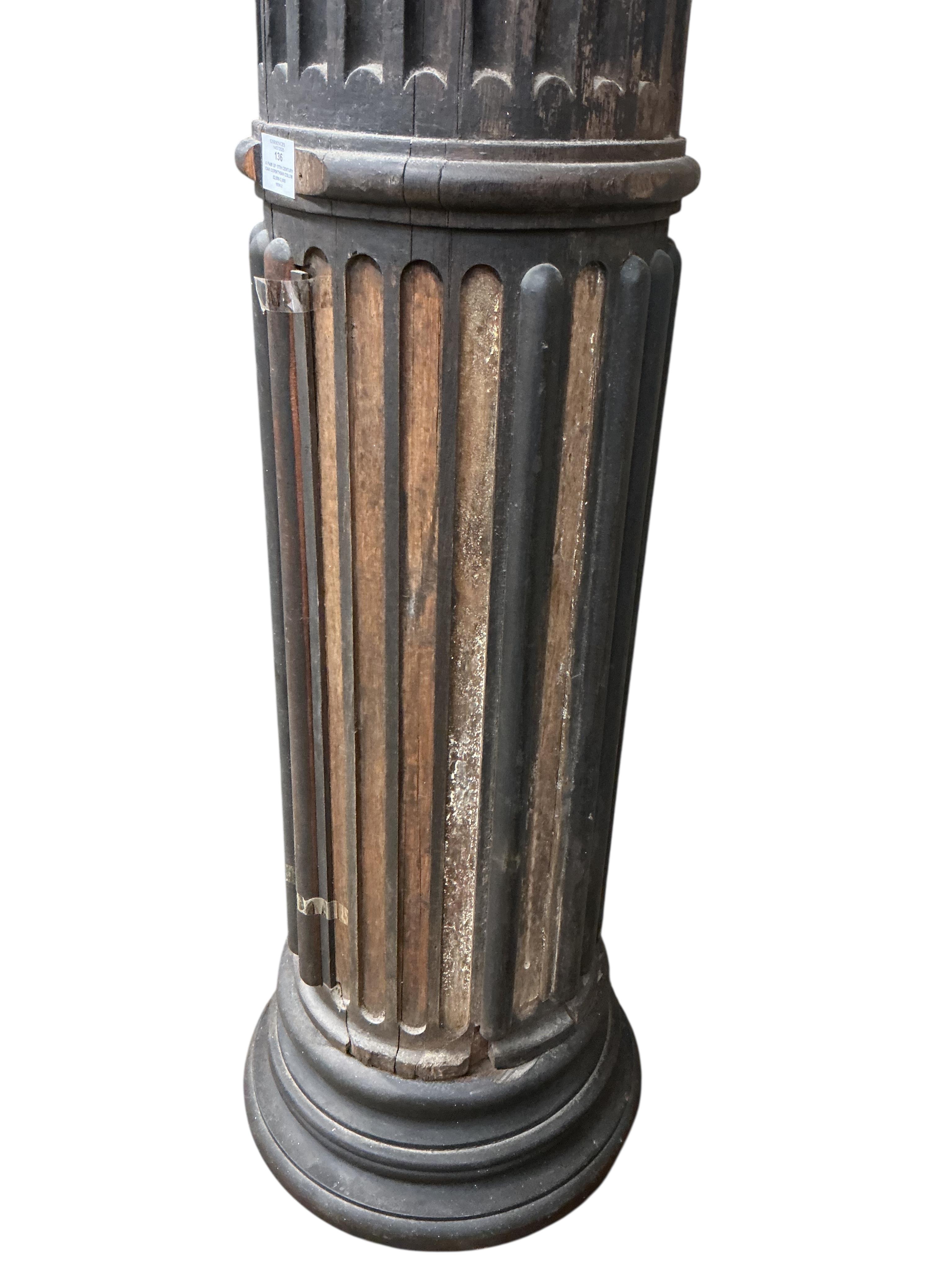 A pair of 17th century oak Corinthian columns, of large size, height 279cm, by repute from St Mary le Bow, designed by Christopher Wren